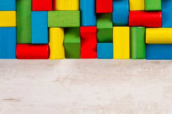 Bloques de juguetes, ladrillos de madera multicolor, grupo de piezas de juegos de construcción de colores — Foto de Stock