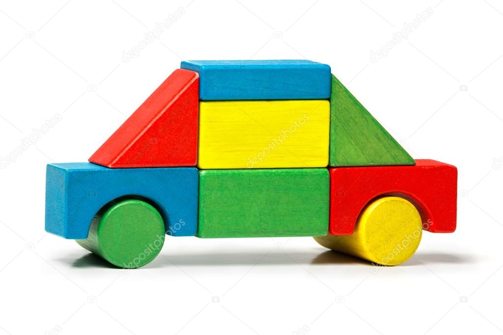 Toy car, multicolor wooden blocks transport over white background