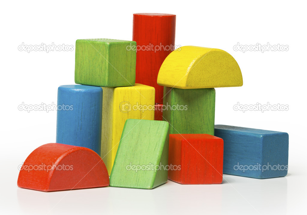 Toy wooden blocks, multicolor building bricks isolated over white background
