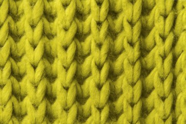 Woolen texture background, knitted wool fabric close up, green hairy fluffy textile