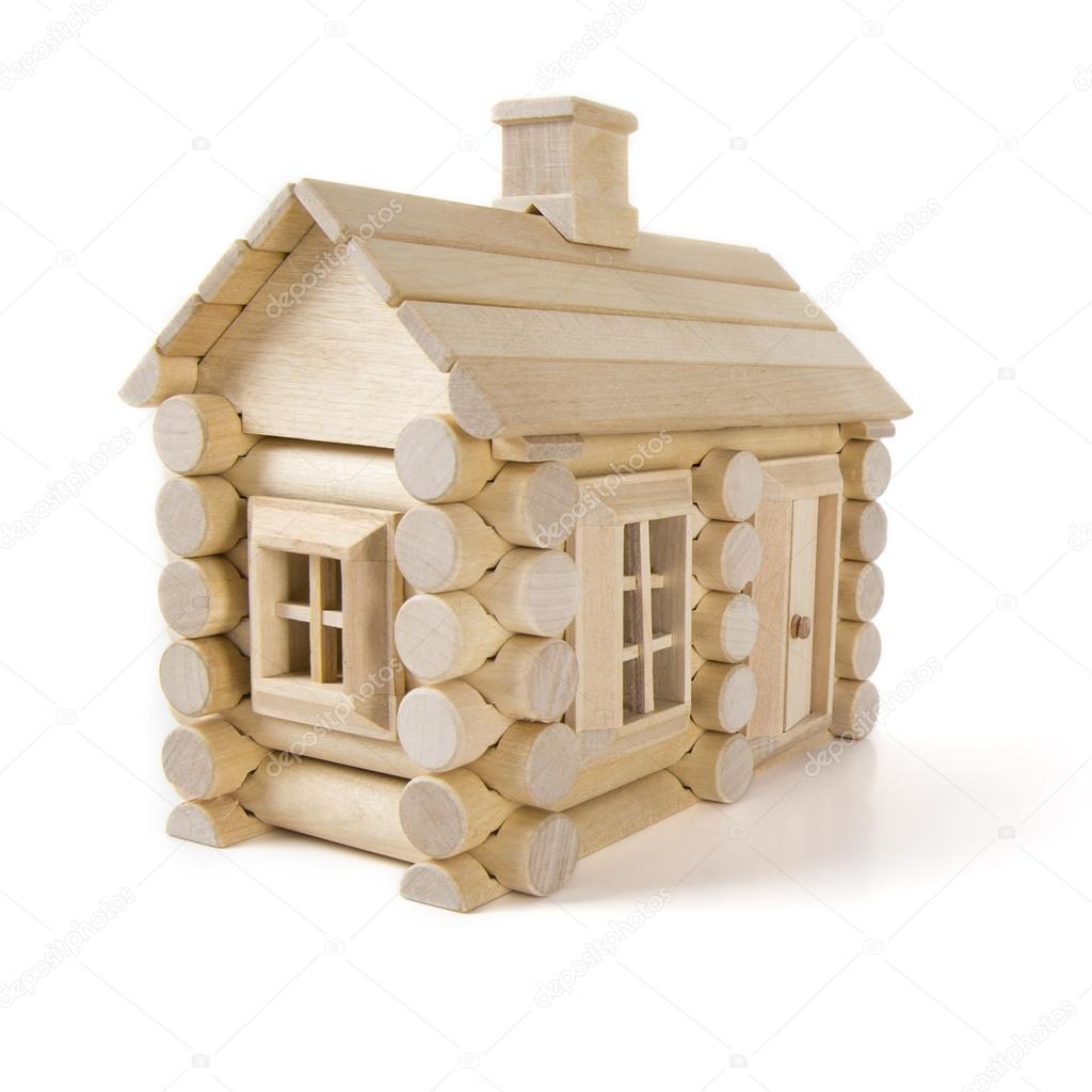 Toy wooden house isolated on white, little cottage home of wood timber