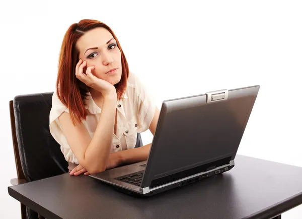 Bored woman at computer Royalty Free Stock Photos