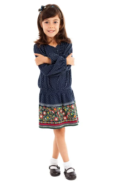 Šťastná holčička s překřížené nohy a ruce — Stock fotografie