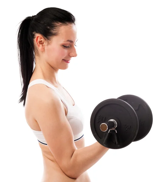 Beautiful woman lifting dumbbell isolated on white background — Stock Photo, Image