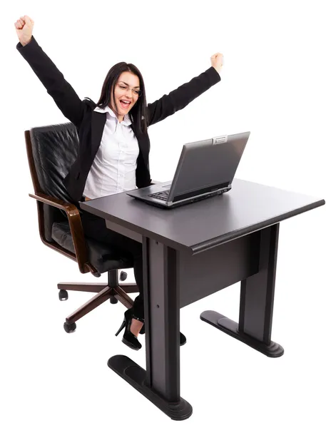 Happy businesswoman celebrating victory while sitting at office — Stock Photo, Image