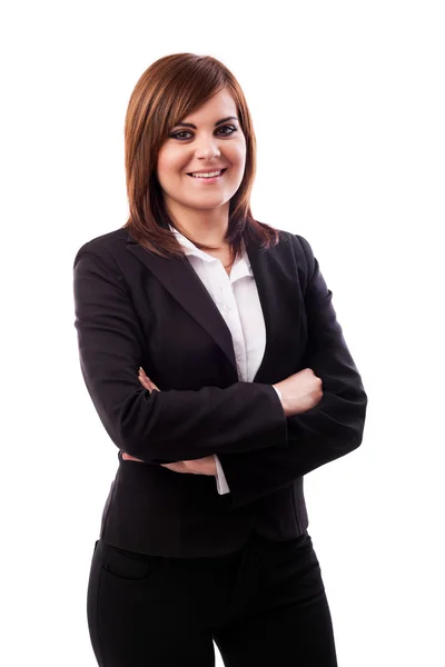 Beautiful businesswoman standing with crossed arms — Stock Photo, Image