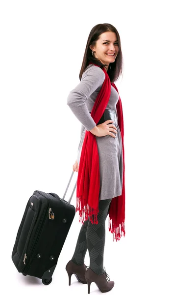 Young traveler woman holding a luggage — Stok fotoğraf