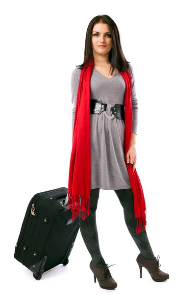 Young traveler woman holding a luggage — Stockfoto