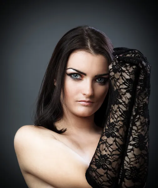 Topless brunette wearing black lace gloves — Stock Photo, Image