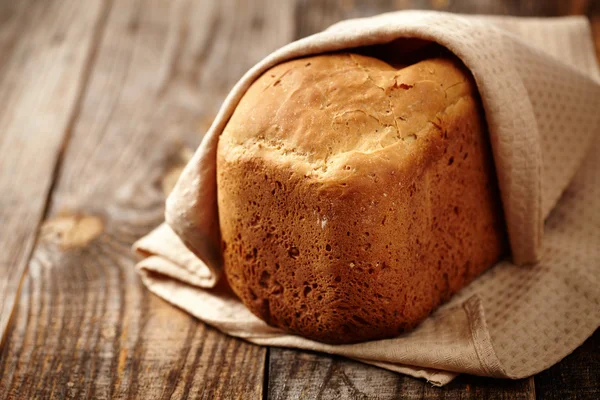 Homemade bread on a wooden board — Stock Photo, Image