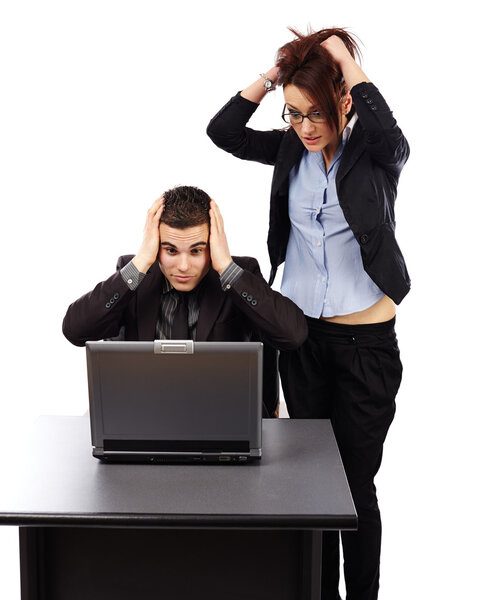 Young businesspeople having trouble with their laptop