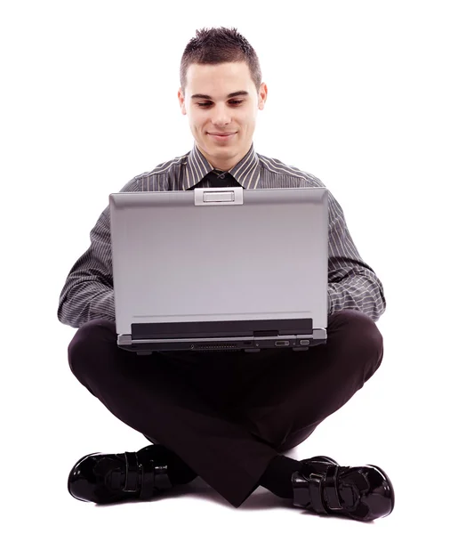 Jovem empresário com laptop — Fotografia de Stock