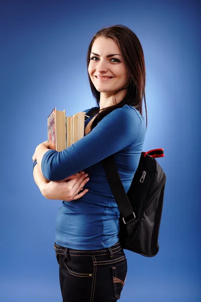 Student meisje met rugzak en boeken — Stockfoto