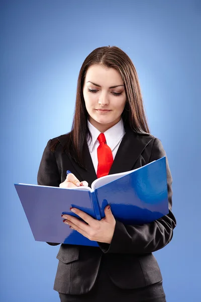 Young businesswoman taking notes Stock Image