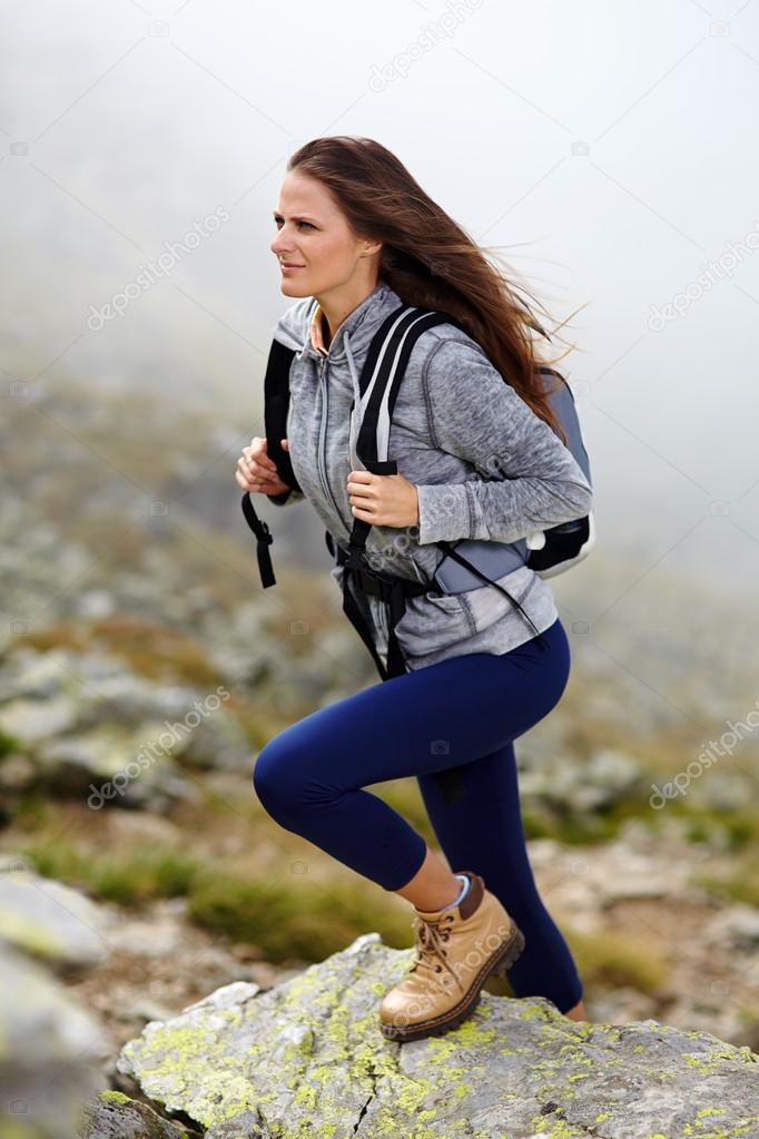 Woman hiker climbing