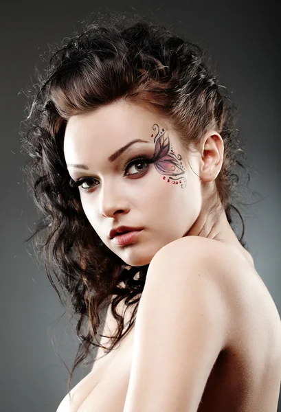 Mulher bonita usando maquiagem fantasia Fotografias De Stock Royalty-Free
