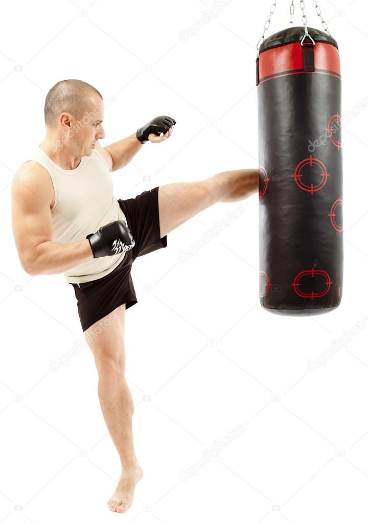 Boxer kicking the punching bag