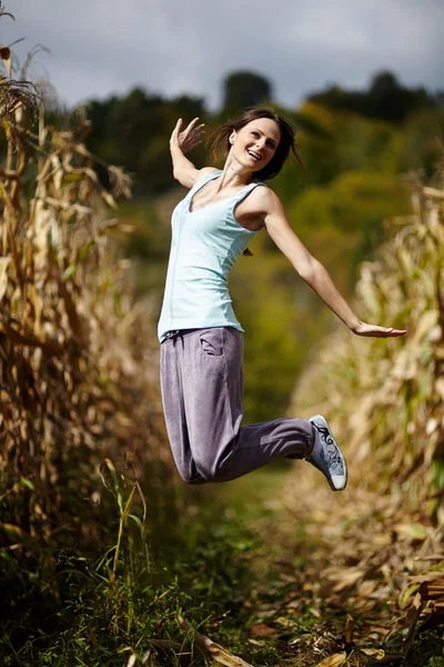 Young woman jumping of joy — Stock Photo, Image