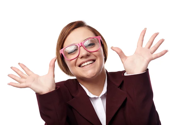 Woman wearing nerg glasses and making funny faces — Stock Photo, Image