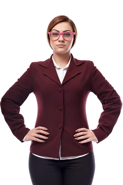 Severe teacher wearing glasses and standing akimbo — Stock Photo, Image