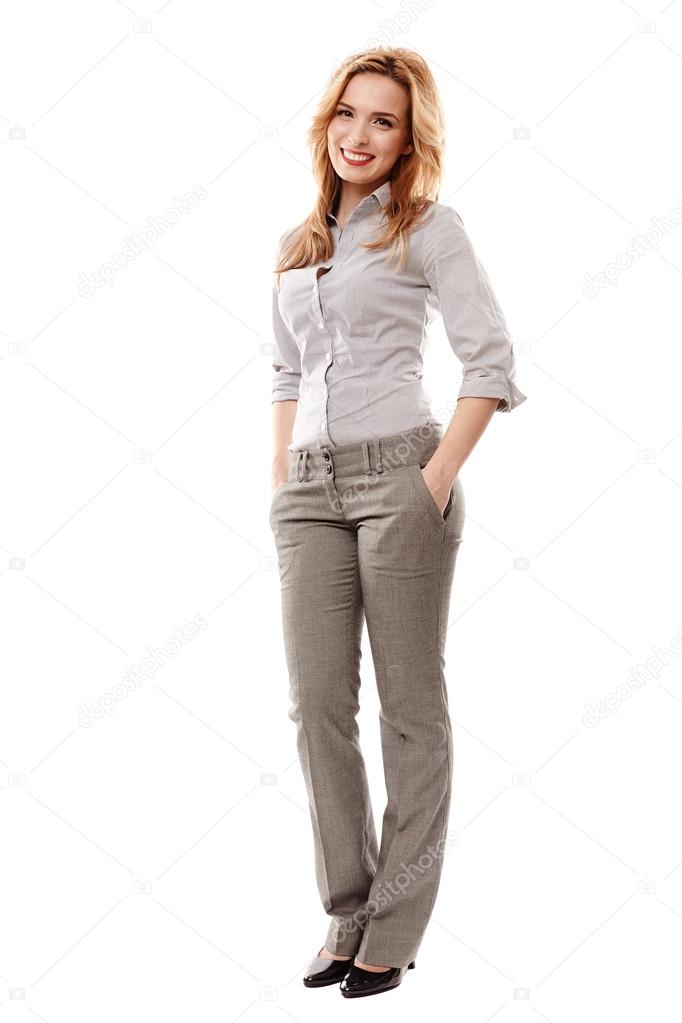 Cheerful businesswoman with hand on hip