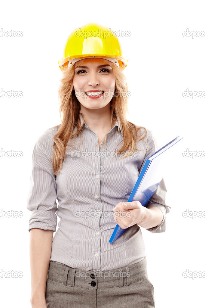 Cheerful woman engineer wearing protection helmet and holding a