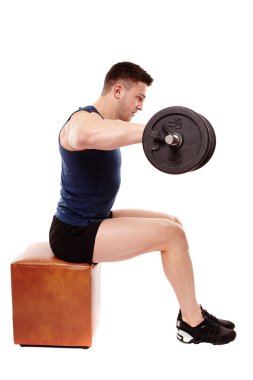 Handsome man working with heavy dumbbells clipart