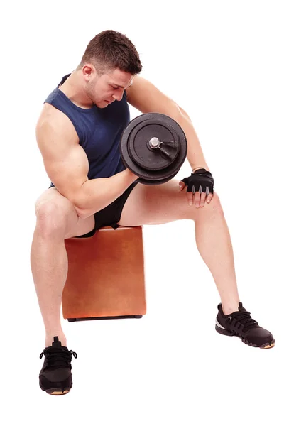 Handsome man working with heavy dumbbells — Stock Photo, Image