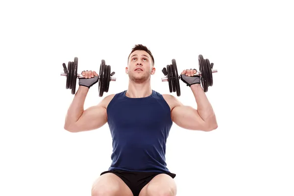 Young man working with dumbbells — Stock Photo, Image