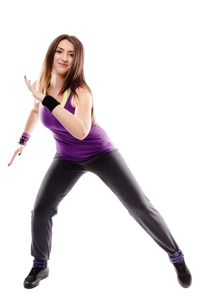Mladá sportovní žena dělá taneční pohyby — Stock fotografie