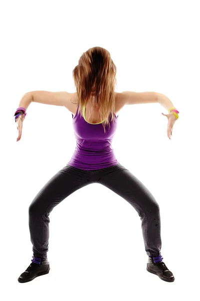 Mladá sportovní žena dělá taneční pohyby — Stock fotografie