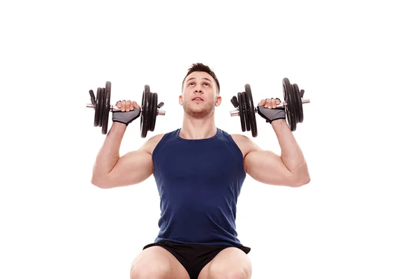 Young man working with dumbbells Stock Image