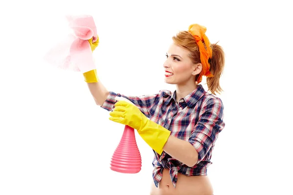 Sexy huisvrouw houdt een stuk van doek en een spray — Stockfoto