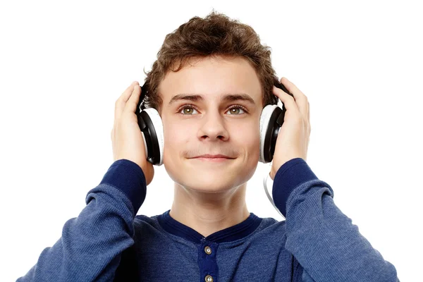 Teenager enjoying listening to music at headphones — Stock Photo, Image