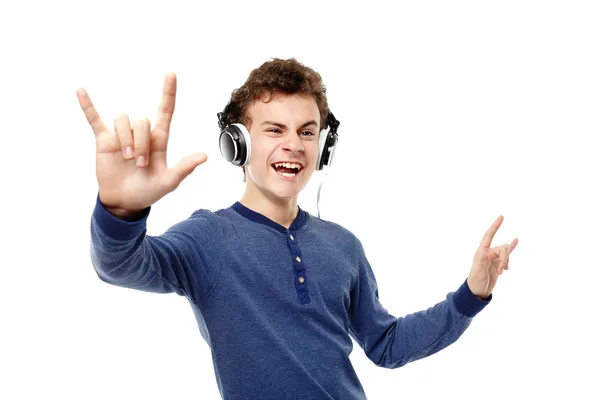 Teenager enjoying listening to music at headphones and making th — Stock Photo, Image