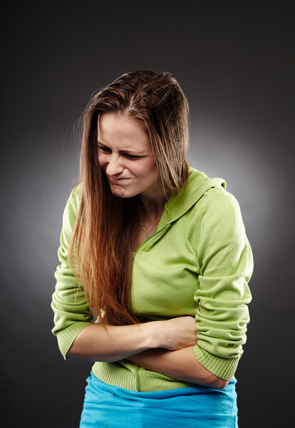 Girl with strong stomach pain