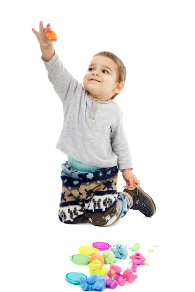 Little boy playing with plasticine — Stock Photo, Image