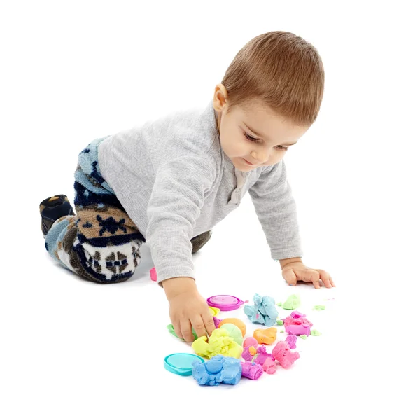 Little boy playing with plasticine — Stock Photo, Image