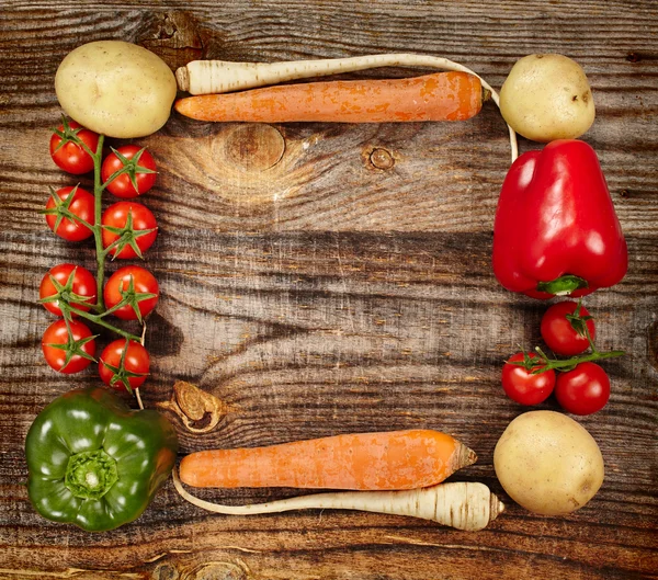 Vegetables frame on wooden board