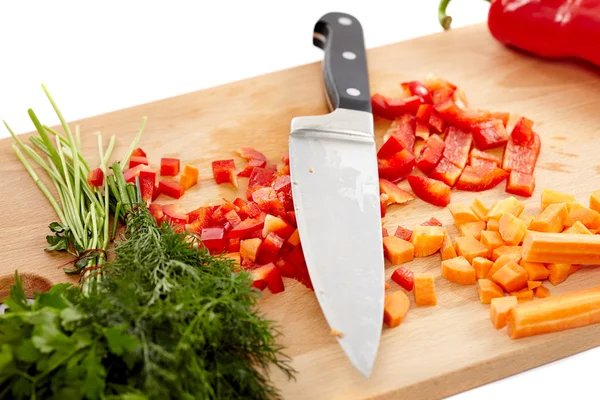 Knife and chopped vegetables — Stock Photo, Image