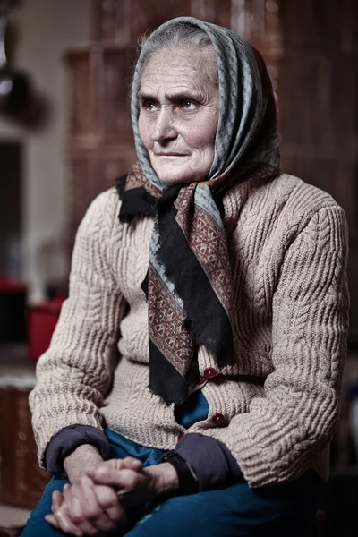 Old woman indoors — Stock Photo, Image