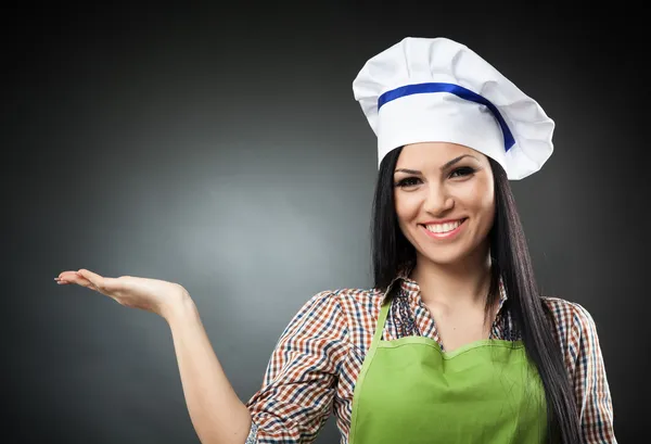 Latijns-chef-kok vrouw presenteren de copyspace Stockfoto