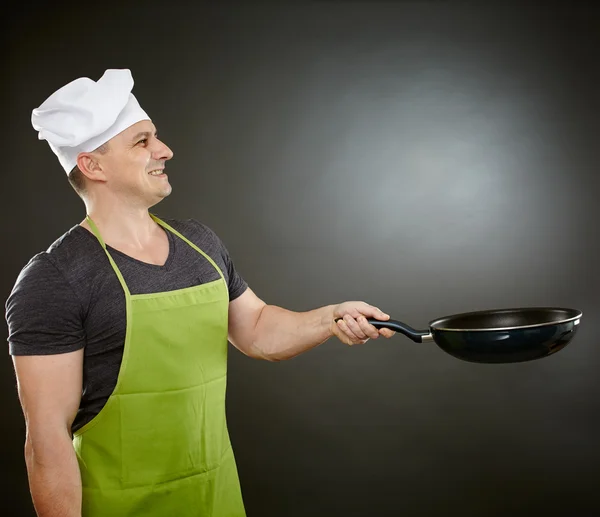 Cook with wok Royalty Free Stock Images