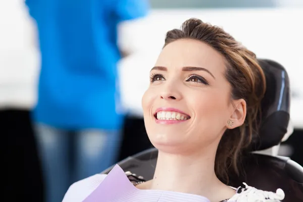 Woman patient at the dentist waiting to be checked up — Stock Photo, Image