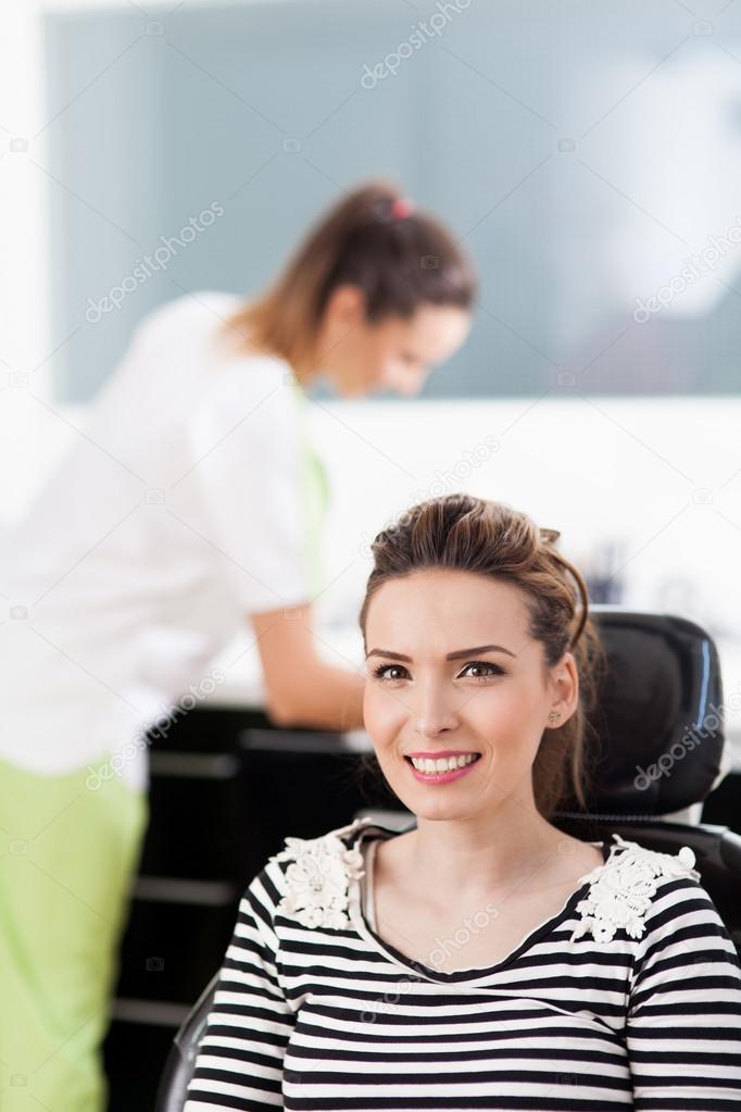 Woman patient at the dentist waiting to be checked up