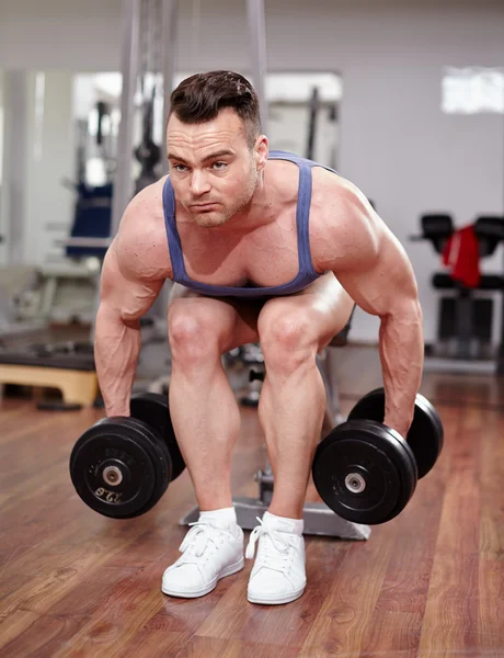 Man working with dumbbells — Stock Photo, Image