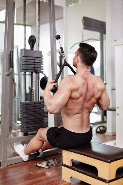 Workout at cable machine — Stock Photo, Image