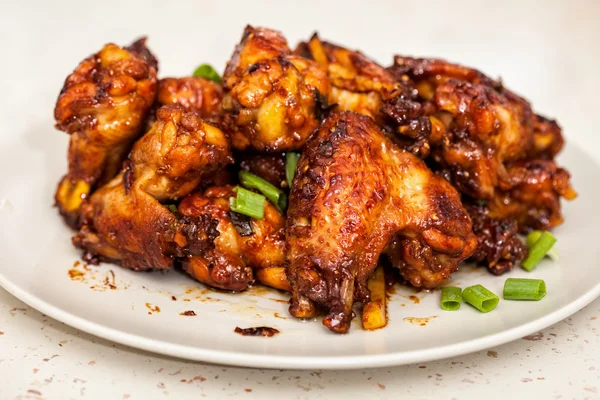 Caramelized chicken wings — Stock Photo, Image