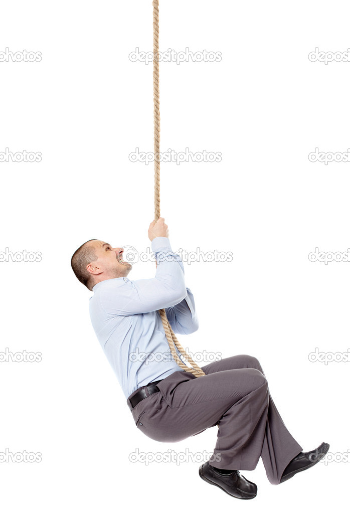 Businessman climing on a rope