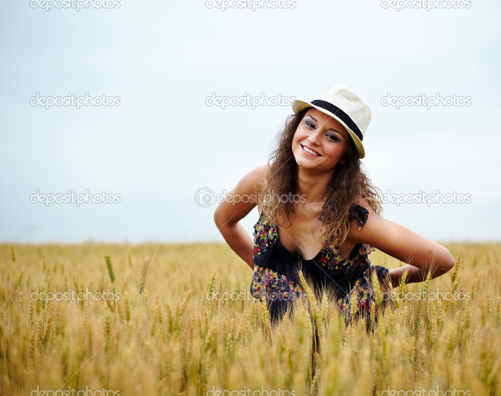 Happy young woman in wheat field